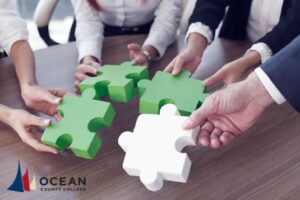 people putting puzzle pieces together