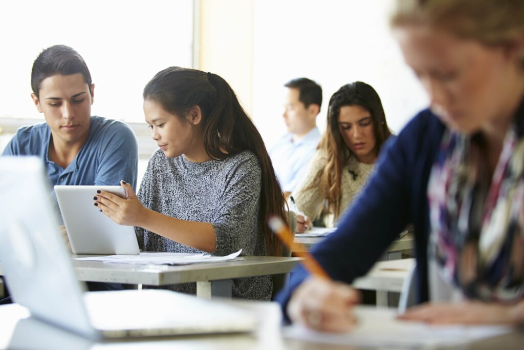 Students working in a classroom on laptops