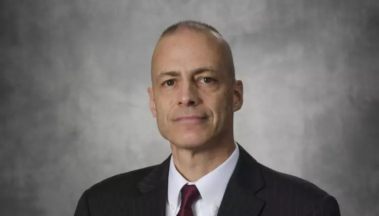 OCC alumni Gregg Bauer professional portrait with grey background