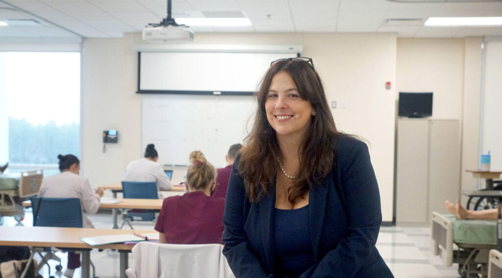 OCC alumni Renee White in her classroom with students