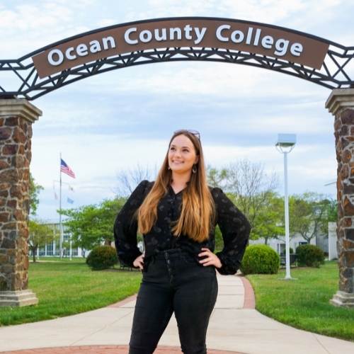 Hailey Sadowski Campus Archway Hailey Sadowski standing under OCC's Archway