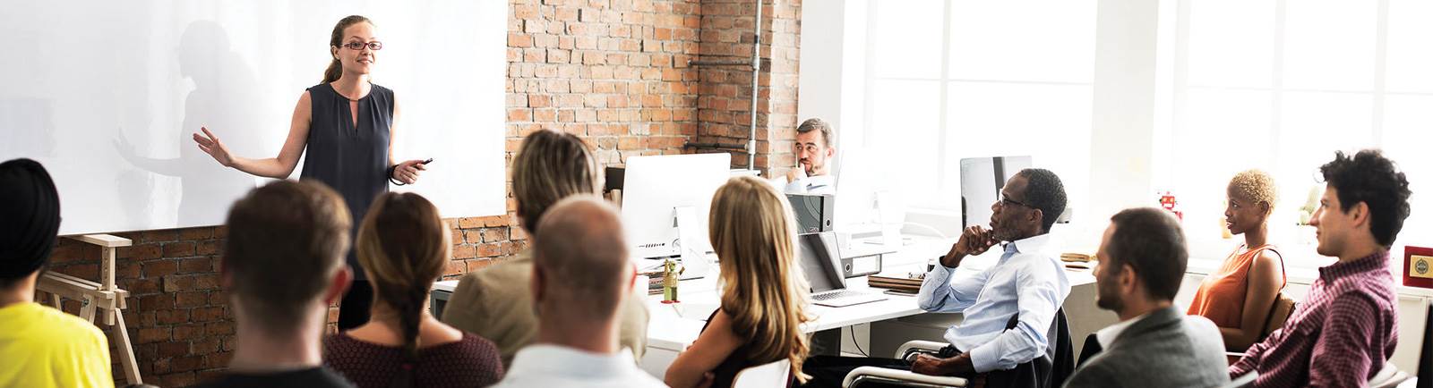 group of professionals sitting in a meeting