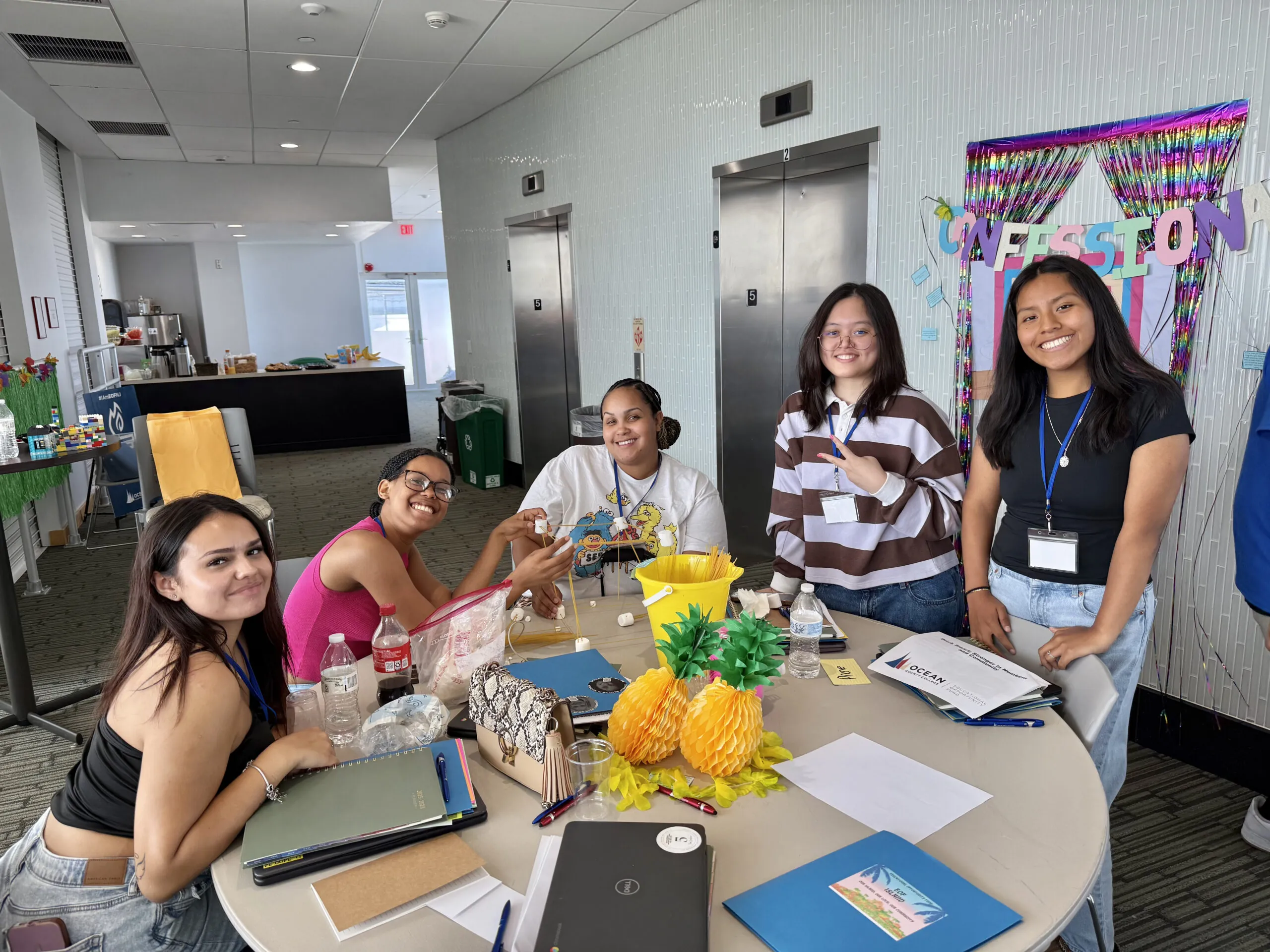 Group of EOF students sitting around a table