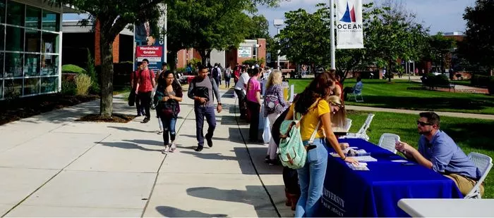 Students meet with 4-year college representatives during the College Fair.