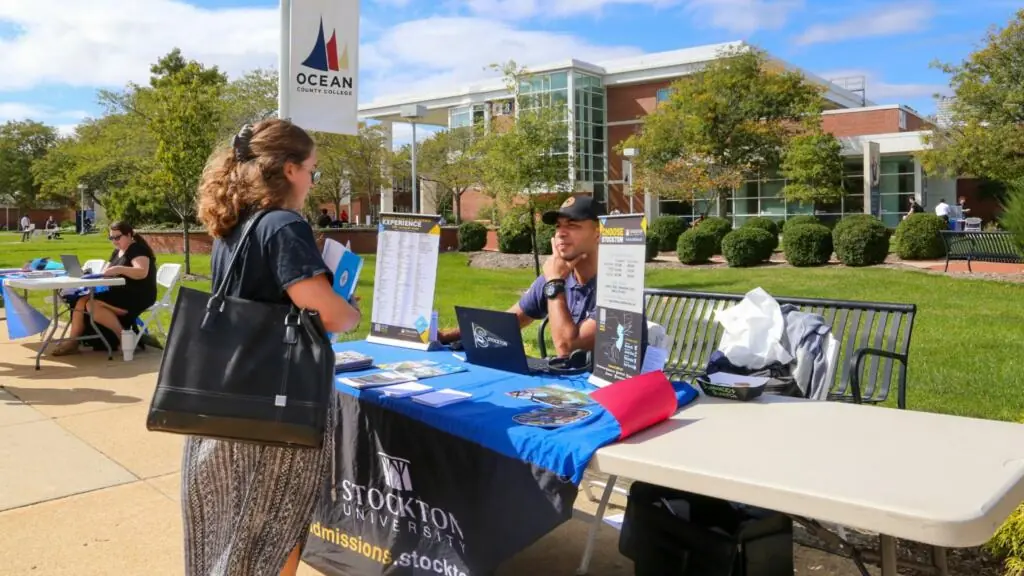 Students meet with 4-year college representatives during the College Fair.